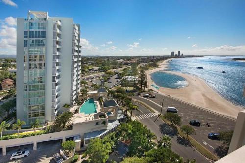an aerial view of a beach and a tall building at RetroRhapsody in Gold Coast