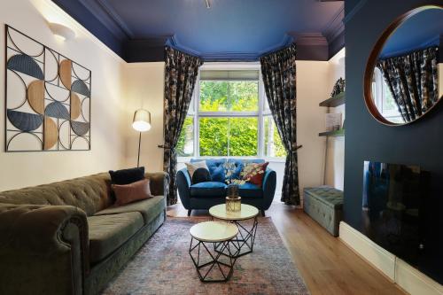 a living room with a couch and a window at 3 bed city centre, FREE parking, Contractors, Long Stays in Doncaster