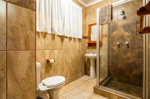 a bathroom with a toilet and a shower at ATKV Klein-Kariba in Bela-Bela