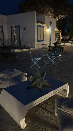 a star on a table in front of a house at Villa Mare Di Montelusa in Agrigento