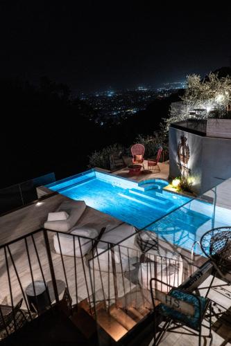 a swimming pool on top of a building at night at Tenuta Zamparina in Montignoso