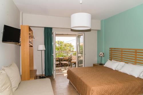 A bed or beds in a room at Lemonia Accommodations
