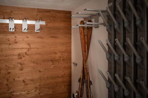 a room with wooden walls and a bunch ofviolins at Chalet Lumis in San Vigilio Di Marebbe