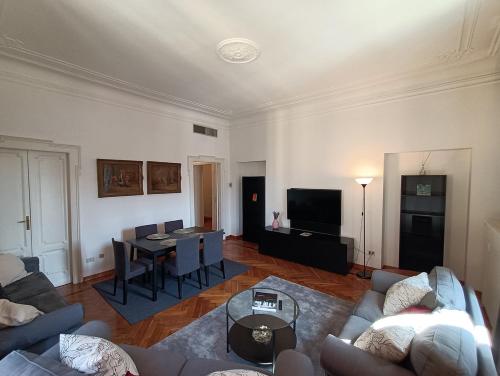 a living room with a couch and a table at SAHI - Residenza Bianca di Savoia in Milan