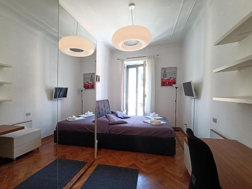 a bedroom with a bed and a mirror at SAHI - Residenza Bianca di Savoia in Milan