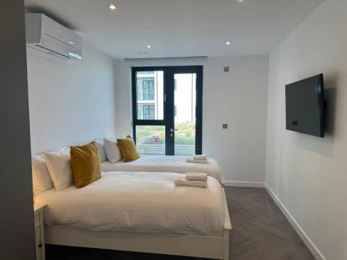 Кровать или кровати в номере Sunrise Escape 2 Bed Inc Parking