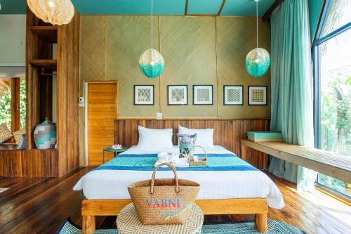 a bedroom with a bed with a basket on it at Varni Homestay in Phatthalung