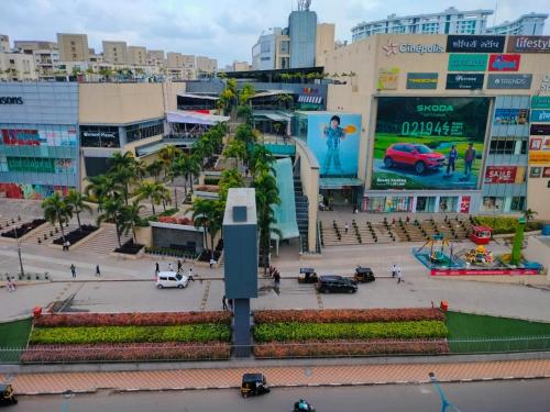 a city street with palm trees and buildings at FabHotel Ekab Hospitality in Pune