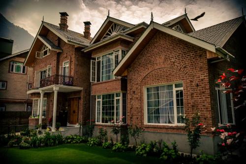 a large brick house with at Zabarwan Peaks Villa in Srinagar