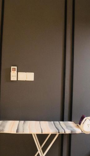 a shelf in a room with a helmet on it at Axon Residence KLCC - KL HOME in Kuala Lumpur