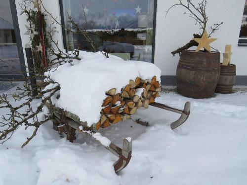 a pile of snow on a tree branch with skis at Hotel Loy in Gröbming