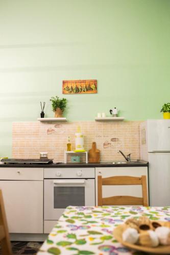 a kitchen with a stove and a counter top at I VACANZIERI in Avola