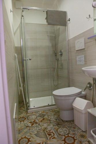 a bathroom with a shower and a toilet and a sink at I VACANZIERI in Avola