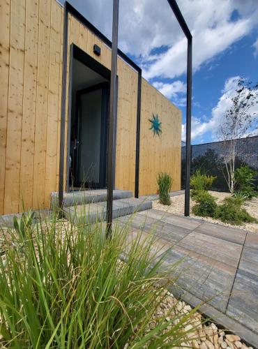 a building with a star on the side of it at Casa en Sol -Therme Balotesti in Baloteşti