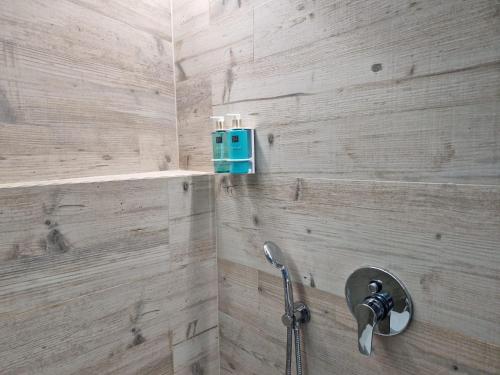 a bathroom with a shower with a blue box on the wall at Vila Costa in São Luis