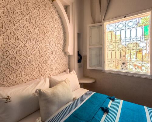 Postel nebo postele na pokoji v ubytování Riad Zayn & Spa