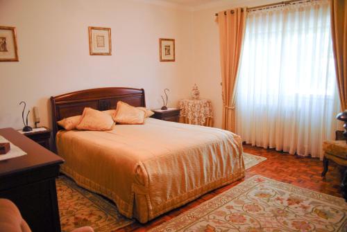 Giường trong phòng chung tại Casa da Nelita