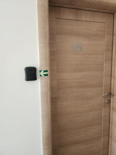 a wooden door with the letter b on it at Riva i Lido Srebrno jezero in Veliko Gradište
