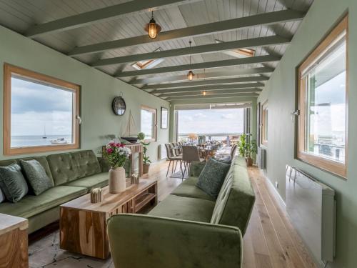 a living room with a couch and a table at The Pontoon - Pass the Keys in Southend-on-Sea