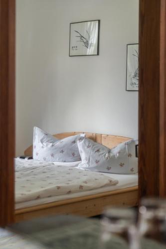 a reflection of a bed in a mirror at Landhaus Arnoth in Kleinich