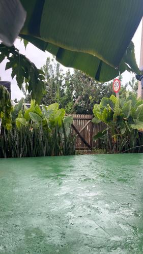 a view of a yard with a no parking sign at Maré suites in Fernando de Noronha