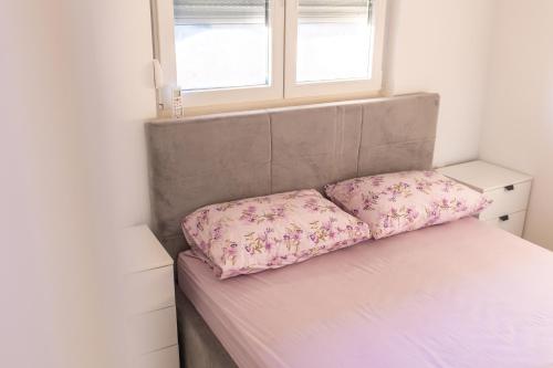 Apartmani Laucにあるベッド