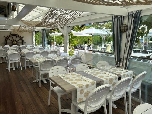 a row of tables and chairs in a restaurant at Marie Siska Boutique hotel in Knokke-Heist