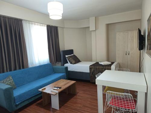 Χώρος καθιστικού στο White Crown Apartman ve Yaşam Merkezi