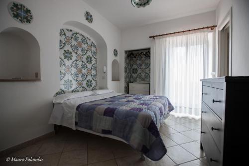 Katil atau katil-katil dalam bilik di Hotel 4 Stagioni