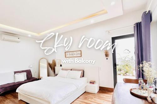 a bedroom with a white bed and a sign that reads city room with bakery at Cloudy Homestay Hoi An in Hoi An