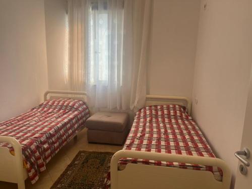 Postel nebo postele na pokoji v ubytování Learti Apartment