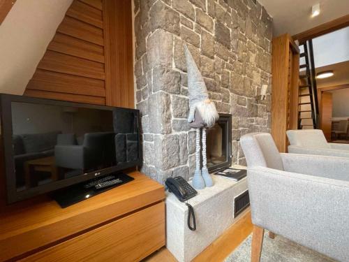 TV a/nebo společenská místnost v ubytování Apartman B610 Hotel Vucko Jahorina