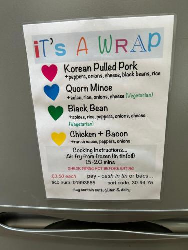 a sign that says it is a wrap with hearts at The coach house in Grimston