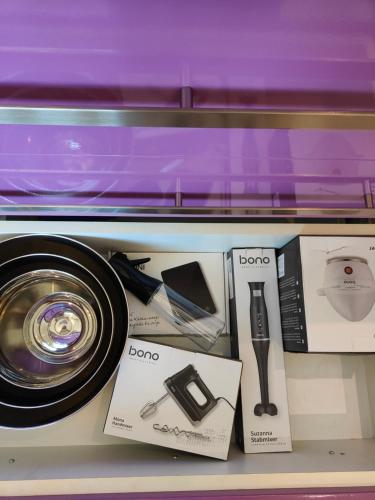 a shelf with a camera and other items on it at Ferienwohnung Dorfleben, nahe Jennersdorf und Therme in Windisch Minihof