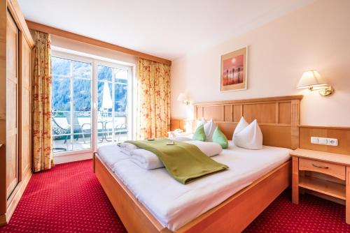 Postel nebo postele na pokoji v ubytování Apparthotel Sonnenhof