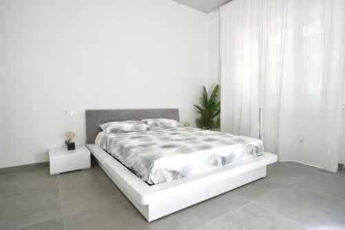 Letto o letti in una camera di Elegante appartamento piano terra a 200 mt dal mare