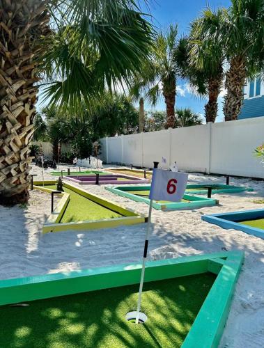 a putting green with a number six on it at The Back Nine in Pensacola Beach