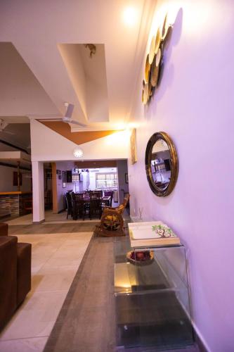 a living room with purple walls and a table at Goshen in Accra