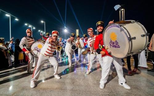 a group of men playing drums in a parade at Velvet Hotel Jeddah in Jeddah