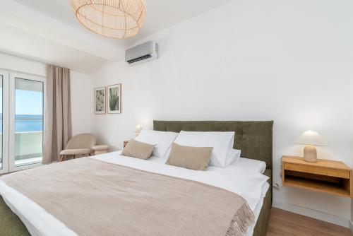 Ένα ή περισσότερα κρεβάτια σε δωμάτιο στο Sea view Apartment Karmen