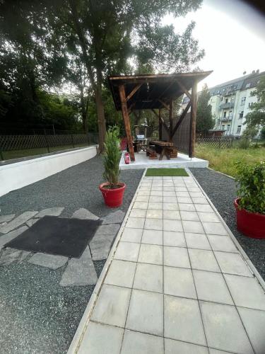 a pavilion with a picnic table in a park at Weißes Haus in Plauen