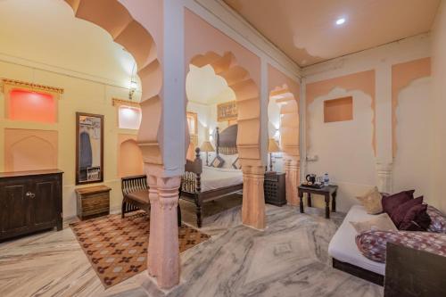 a large room with a bed and a couch at Hotel Shahi Palace Mandawa in Mandāwa