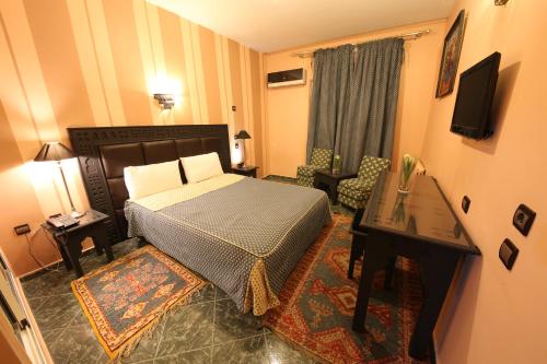 Postel nebo postele na pokoji v ubytování Hotel Akouas
