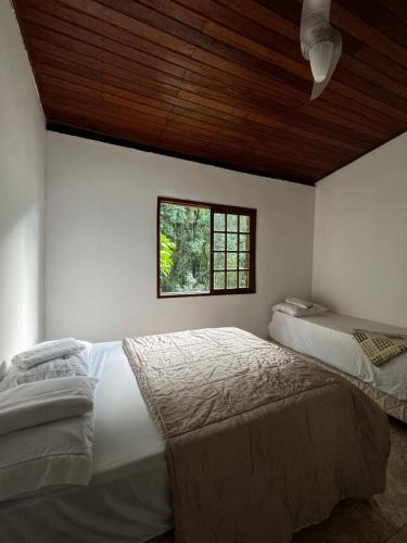 Ένα ή περισσότερα κρεβάτια σε δωμάτιο στο Casa do Soberbo