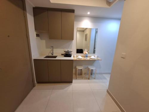 a small kitchen with a sink and a counter at Executive room goldcoast seaview pik in Jakarta