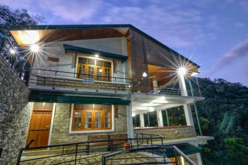 a house with a balcony on the side of it at Mystique Heights in Mawanella