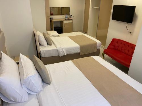 Postel nebo postele na pokoji v ubytování Şimal Hotel