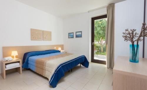 Un pat sau paturi într-o cameră la Kamena Residence