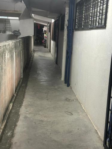 an empty hallway of a building with a long alley at Jaquar Living in Kuala Lumpur