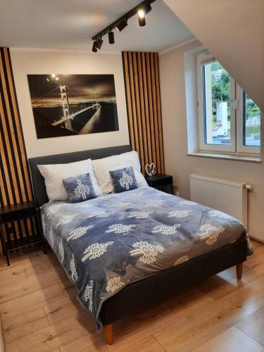 Ένα ή περισσότερα κρεβάτια σε δωμάτιο στο Apartament Szczawnica